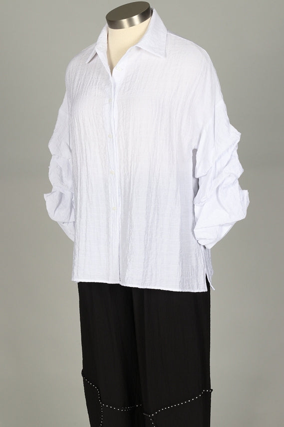 Ruffle Sleeve Button Front Blouse
Perfect for travels near and far, this blouse has a softly crinkled texture with a button front and a classic pointed collar. A flattering A-line design with side slits at the hemline, the three quarter sleeves impress with three tiers of ruffle and a banded cuff. 78% rayon, 22% nylon machine wash cold, tumble dry low made in USA medium measures 44" bust, 29" length XXL measures 50" bust, 30" length style #2403
Ruffle Sleeve Button Front Blouse
Perfect for travels near and
