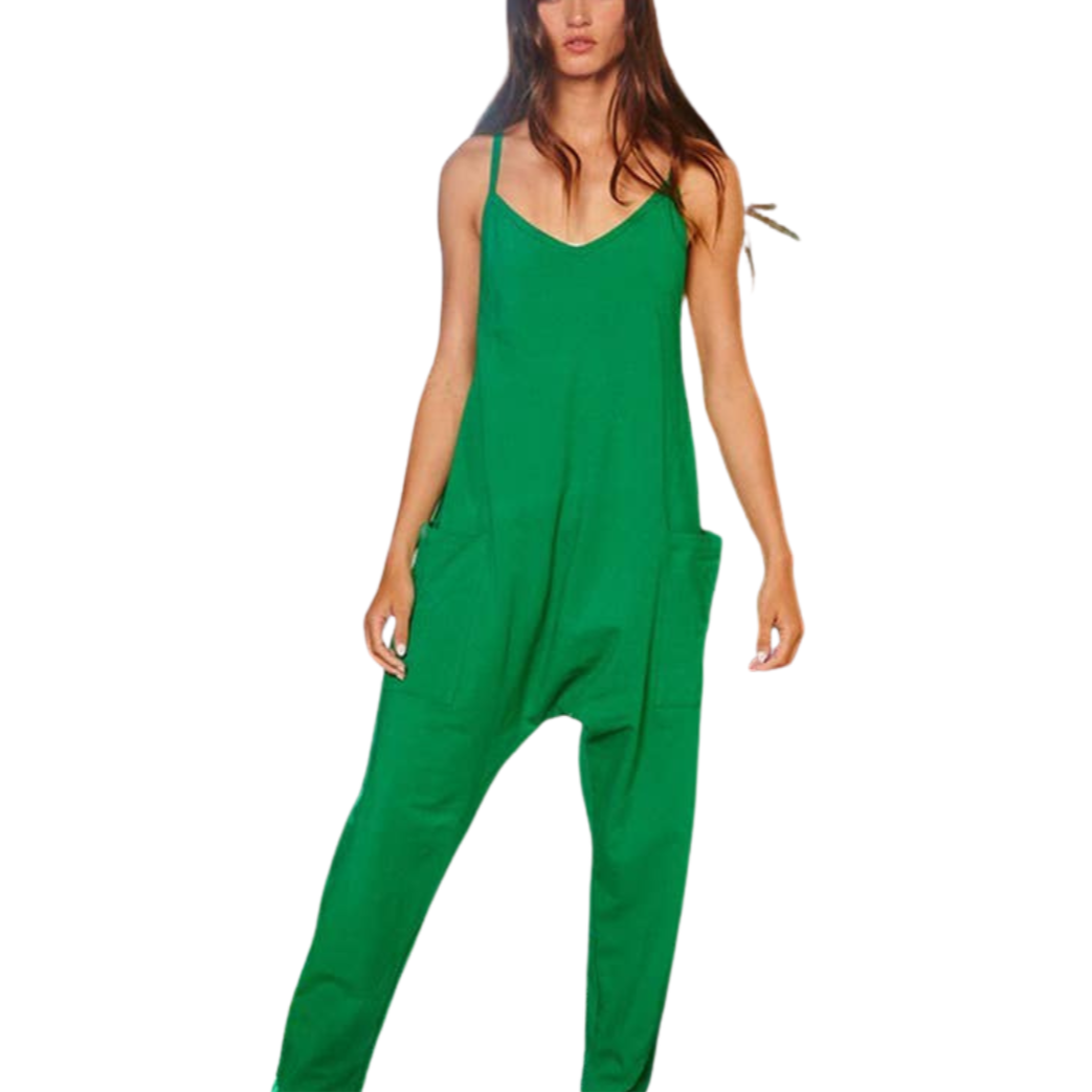A woman wearing a green V-neck solid jersey jumpsuit with oversized patch pockets and a relaxed-fitting design.