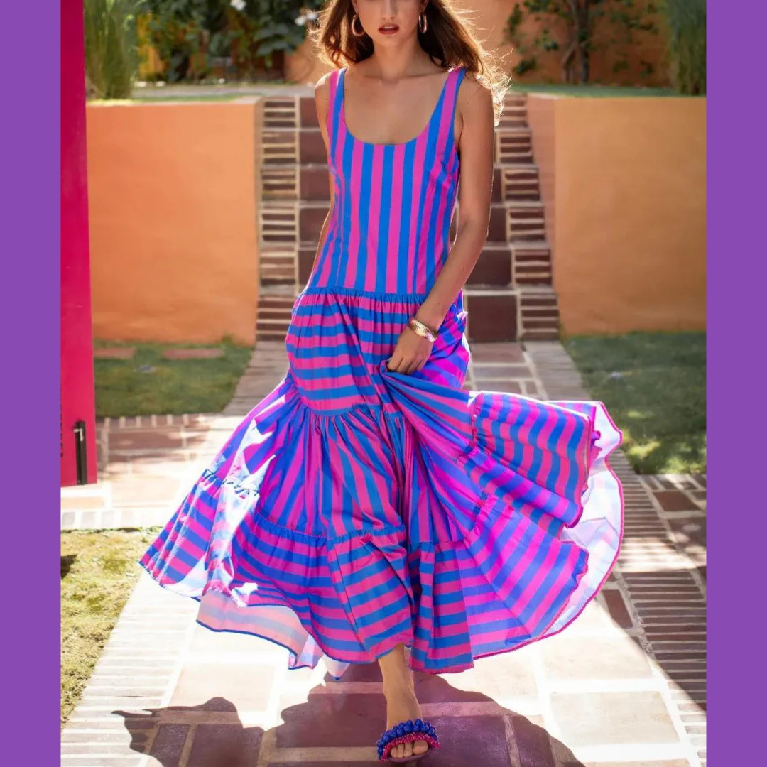 Model wearing fuchsia and indigo striped maxi dress with scoop neck and tiered skirt – Erika Peña Selena Dress
