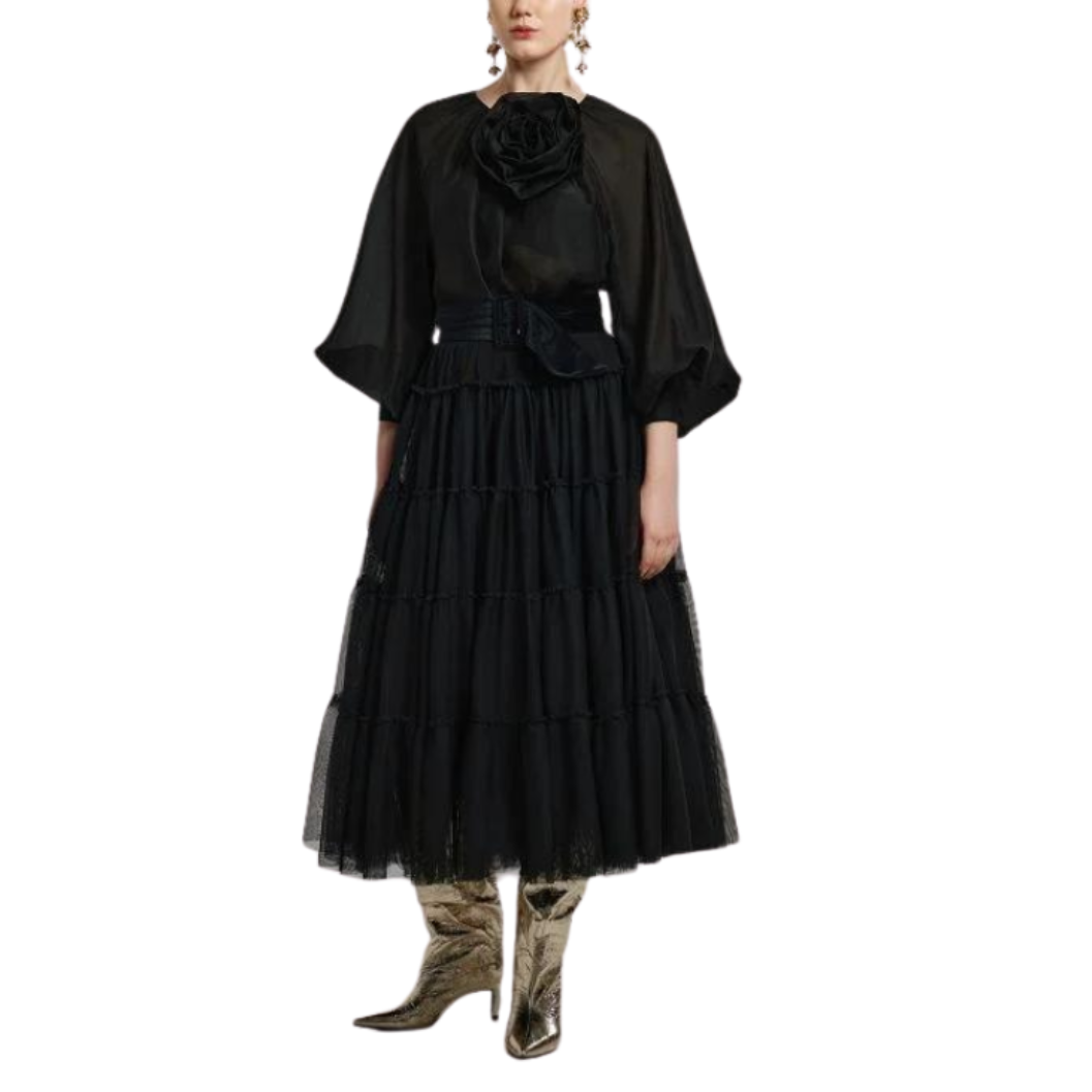 Black dress with a floral detail on a white background