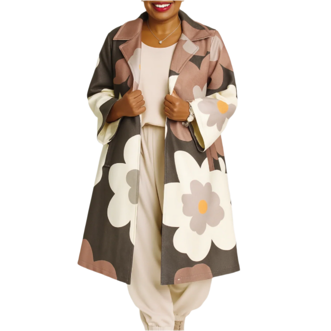 Person wearing a floral patterned coat on a white background