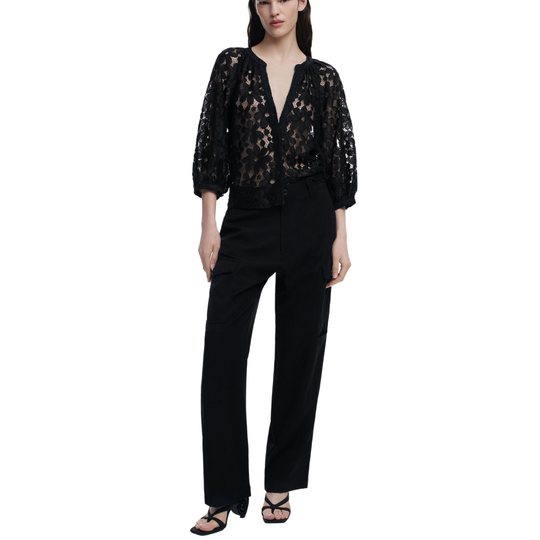 Woman wearing sheer black floral lace blouse with 3/4 sleeves and black tailored trousers – Noir Lace Set