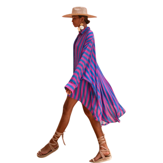 Model wearing oversized striped shirt in fuchsia and indigo with long hem and button front – Erika Peña