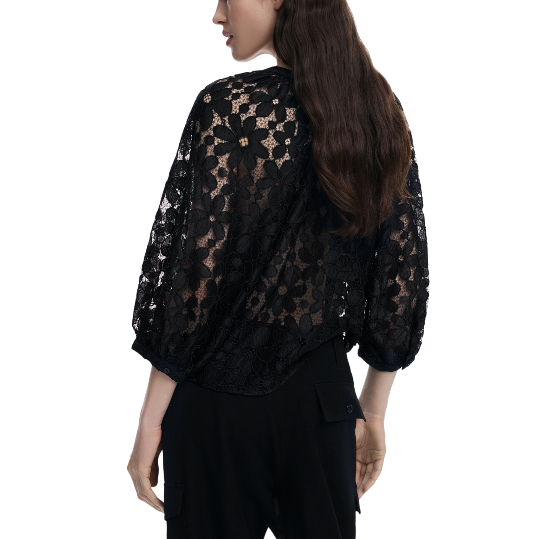 Woman wearing sheer black floral lace blouse with 3/4 sleeves and black tailored trousers – Noir Lace Set