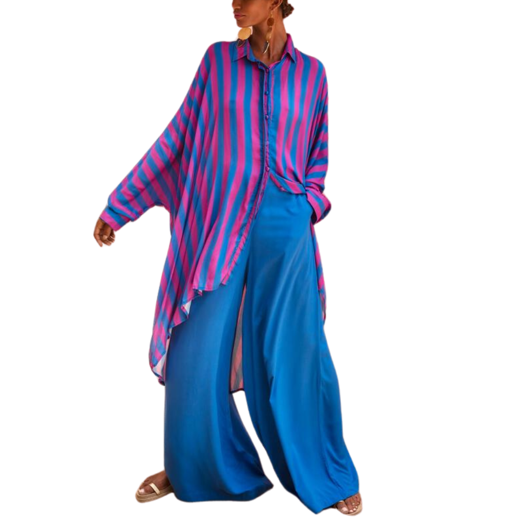 Model wearing oversized striped shirt in fuchsia and indigo with long hem and button front – Erika Peña