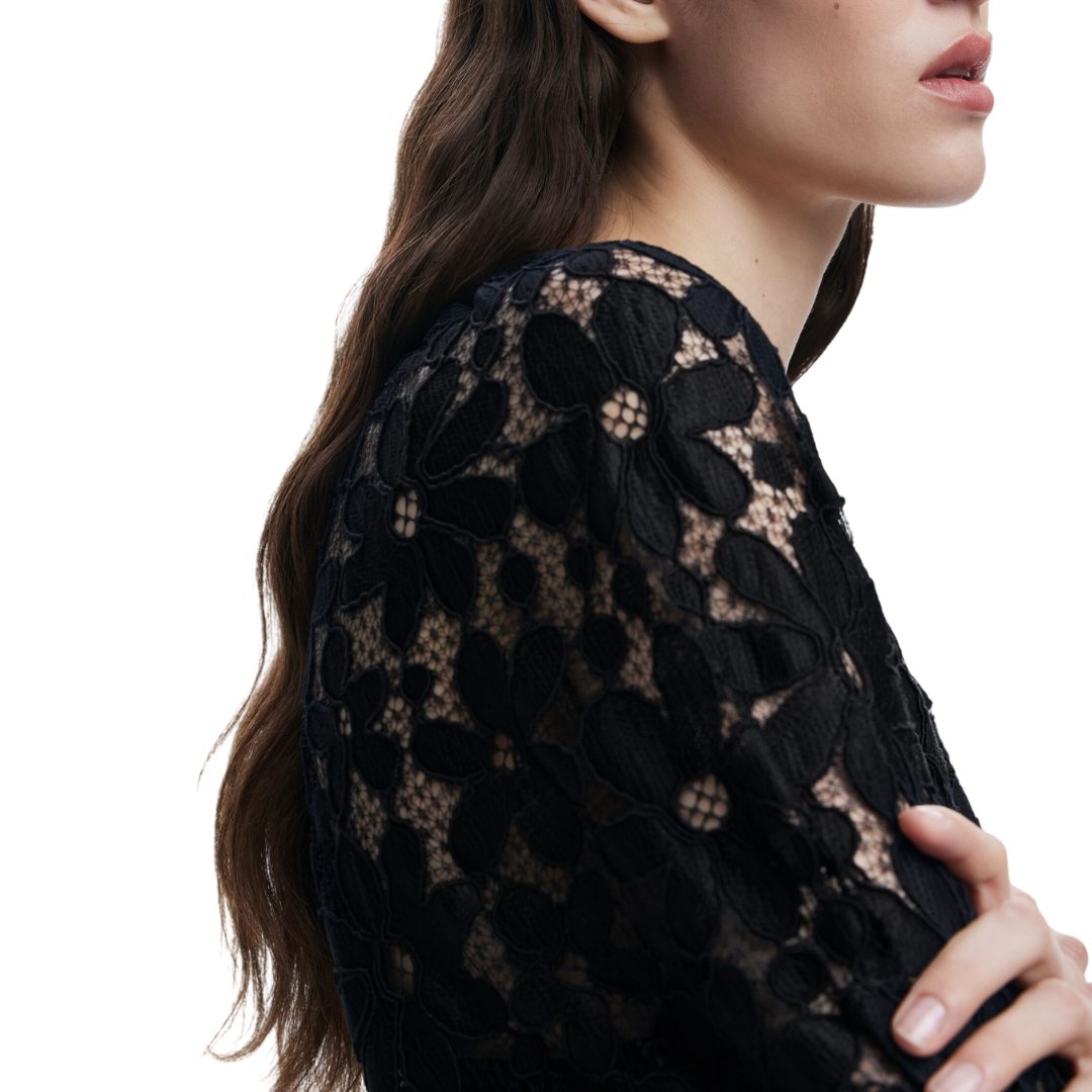 Woman wearing sheer black floral lace blouse with 3/4 sleeves and black tailored trousers – Noir Lace Set