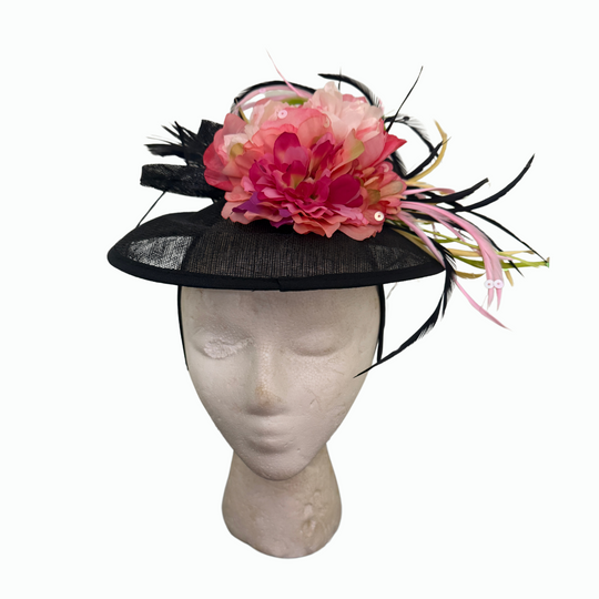 Black brim fascinator with layered pink flower and feather accents, designed by Sandi Jackson – Le’ Diva