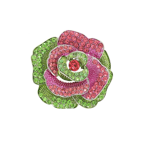 Decorative brooch with pink and green gemstones on a white background