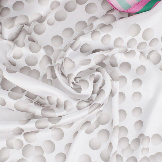 Close-up of white fabric with gray abstract pattern