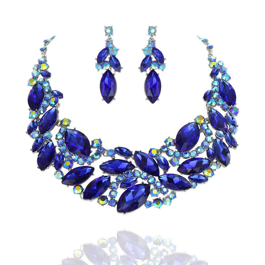 Blue jewelry set with necklace and earrings on a white background