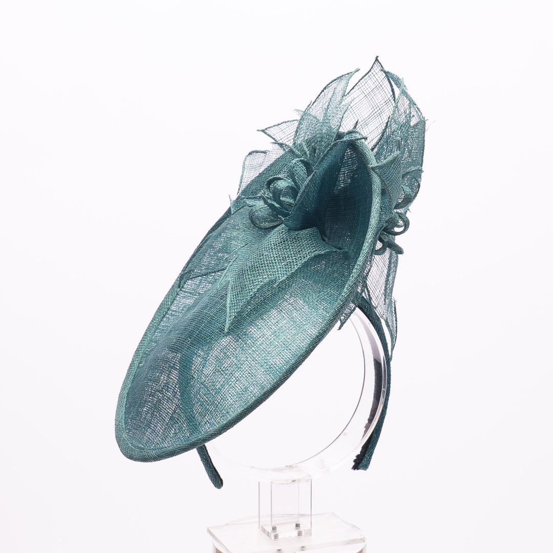 Teal decorative hat on a white background