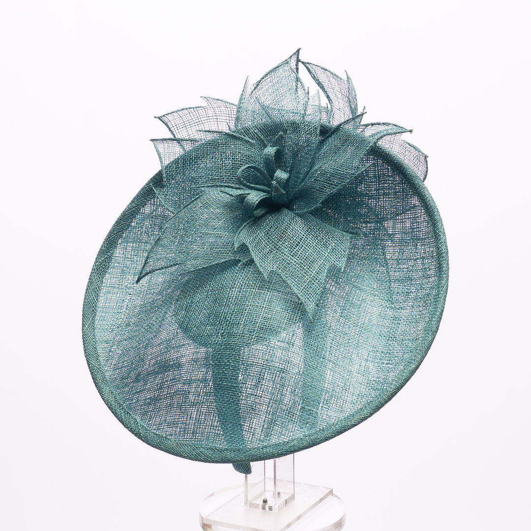 Teal decorative hat on a white background