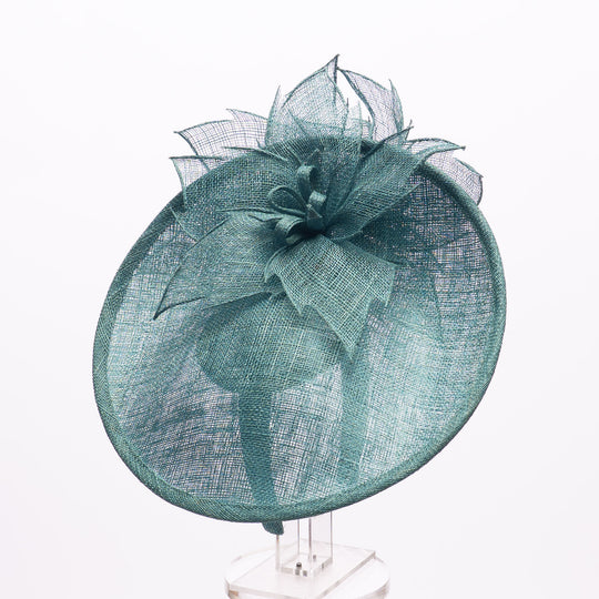Teal decorative hat on a white background