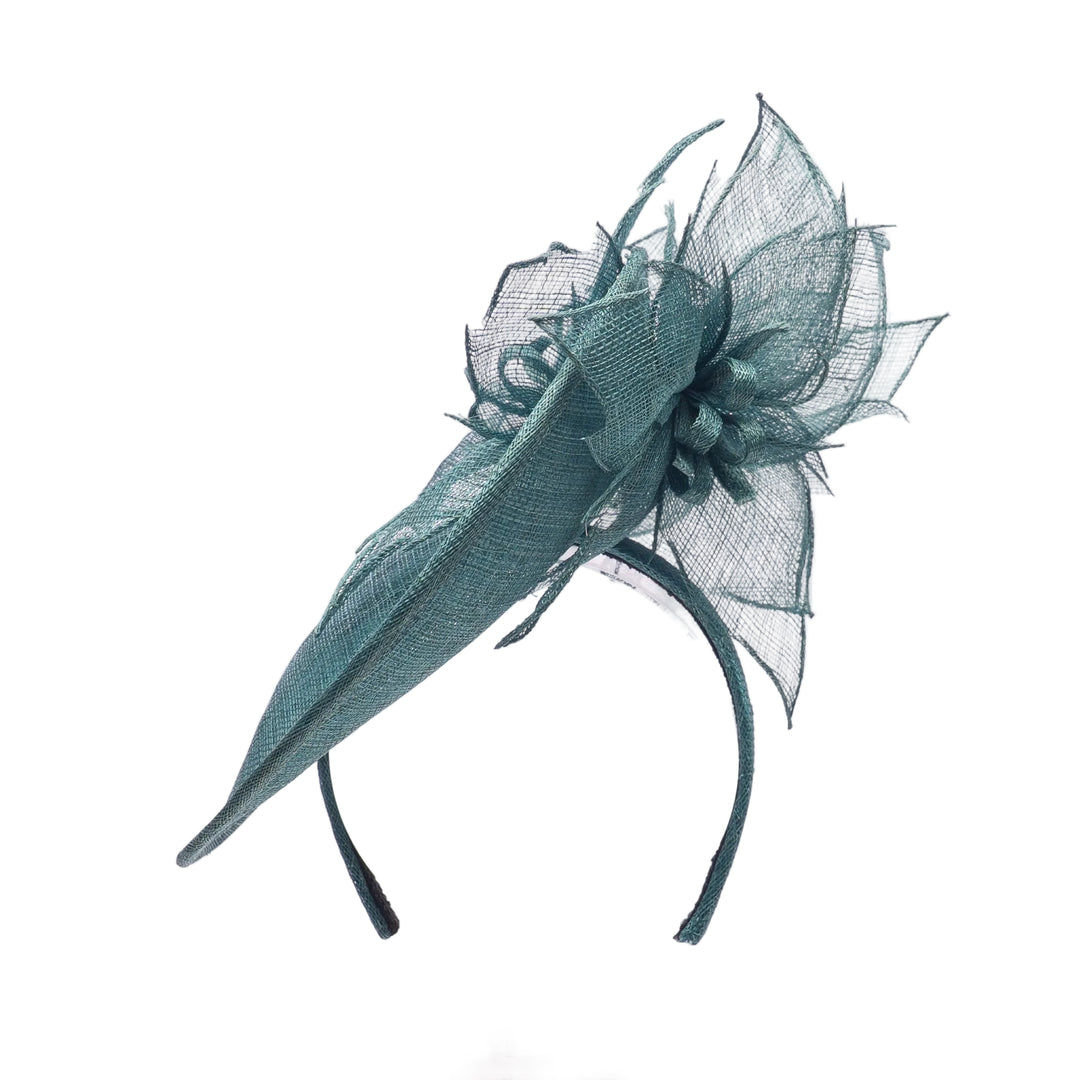Teal decorative headpiece on a white background