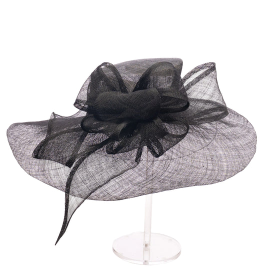 Black decorative hat with a bow on a white background