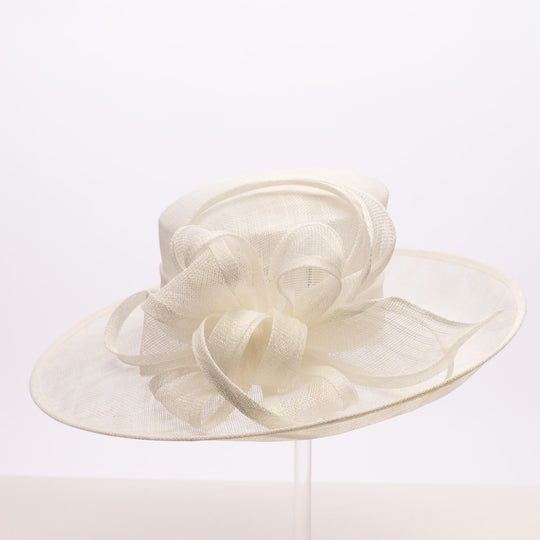 Cream-colored wide-brimmed hat with decorative elements on a white background
