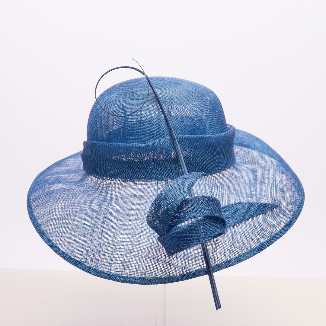 Blue straw hat with a decorative bow on a white background