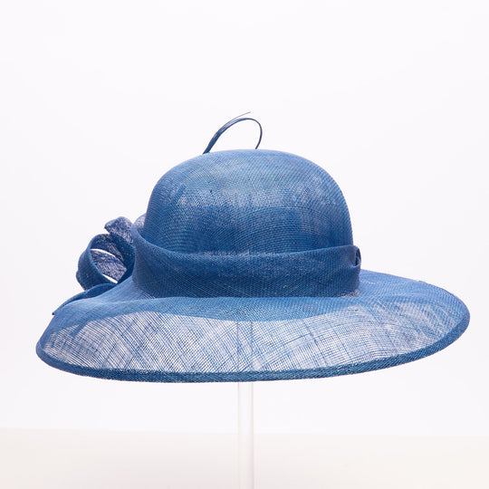 Blue straw hat with a wide brim on a white background