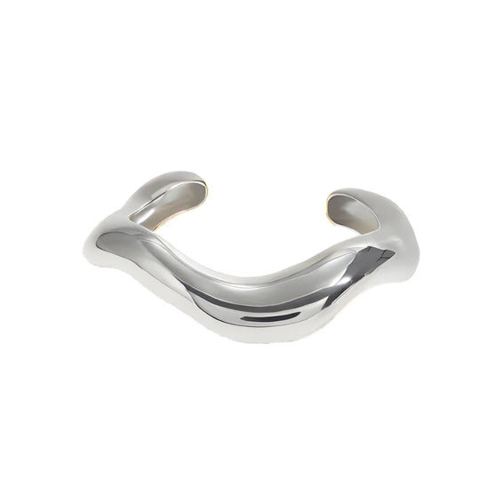 Silver Wave Cuff Bracelet side angle – sculptural wave design, stainless steel silver cuff