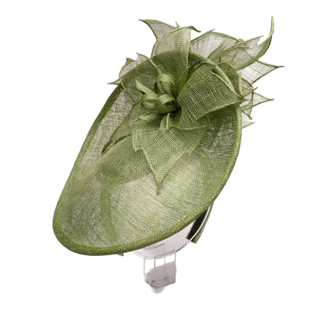 A lime green sinamay flower top and bottom saucer fascinator with a headband, displayed on a mannequin.