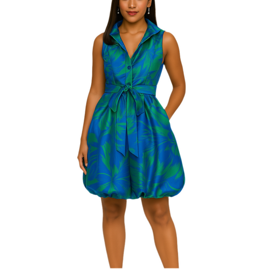 Woman wearing a blue and green patterned dress on a white background