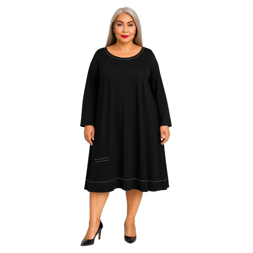 Woman wearing a black dress with white trim on a white background