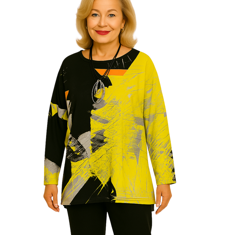 Woman wearing a yellow and black abstract patterned top on a white background
