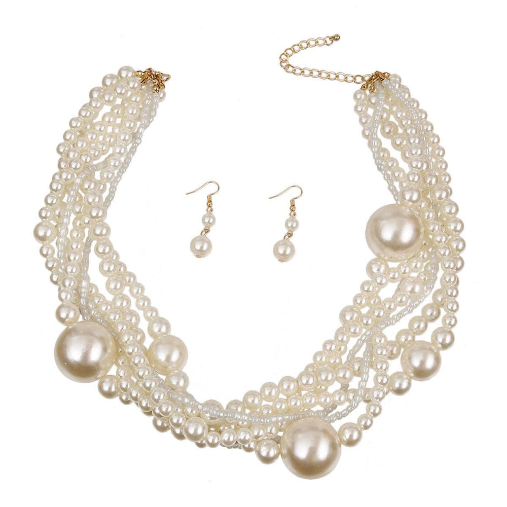 Pearl necklace and earrings set on a white background