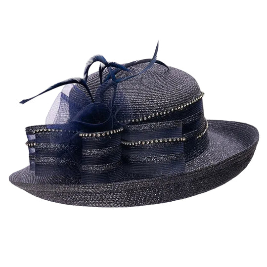 Navy blue decorative hat with feather and netting on a white background