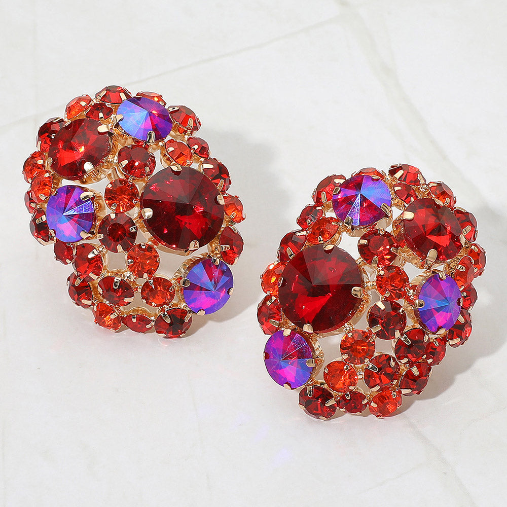 Pair of red and purple gemstone earrings on a white background