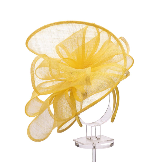 Yellow mesh hat on a clear stand against a white background