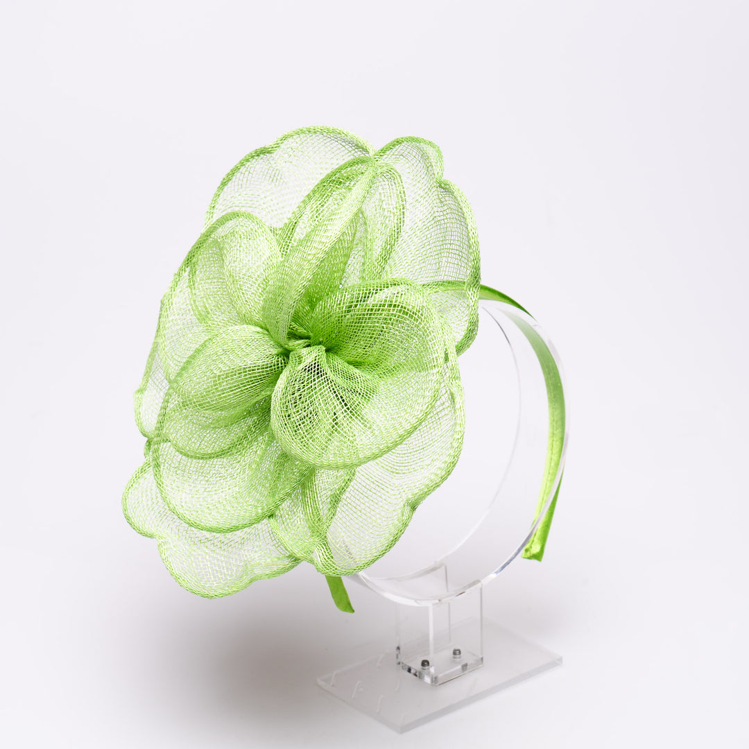 Green mesh headband on a white background