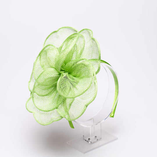 Green mesh headband on a white background