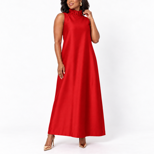 A woman modeling a sleeveless red maxi dress with a ruffled high neckline, photographed against a clean white studio background.