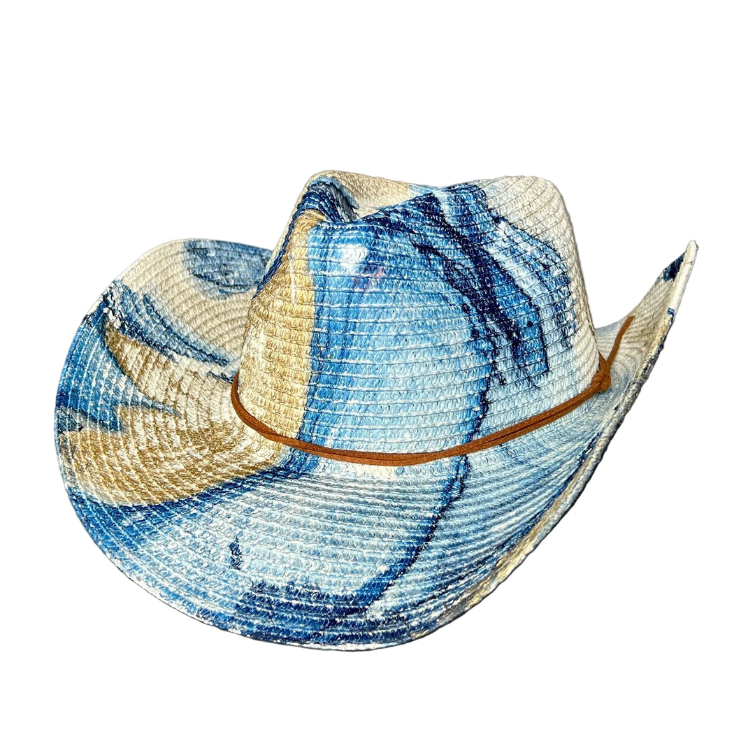 Blue and beige straw hat on a gray surface with a gray background