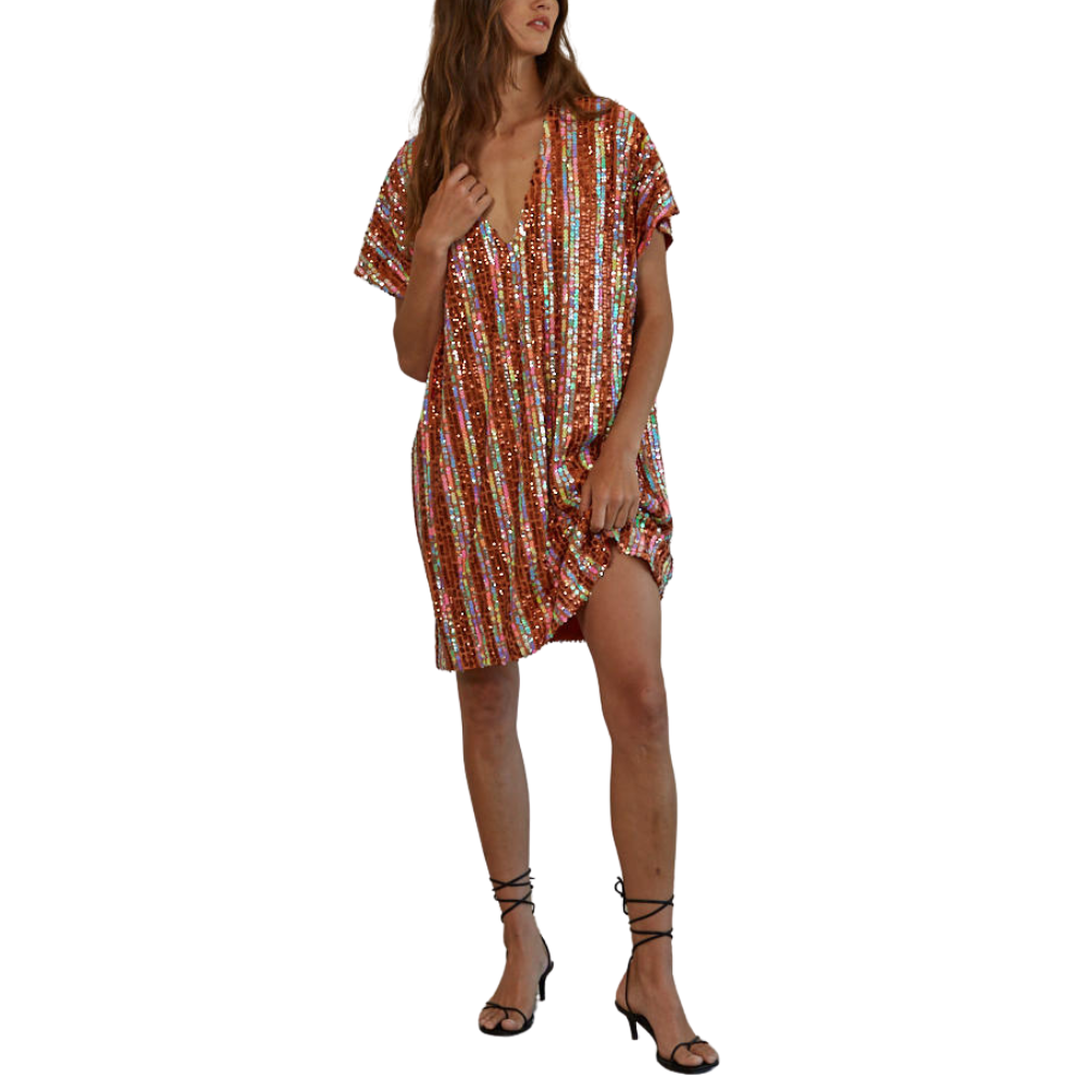 Woman wearing a colorful patterned dress on a white background