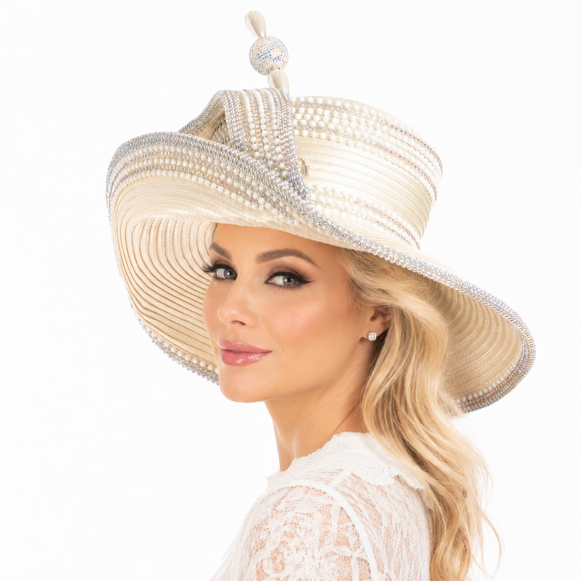 Woman wearing a decorative hat with pearls and crystals on a white background