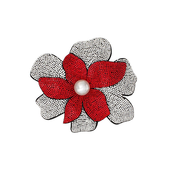 Delta Sigma Theta rhinestone flower brooch pin and hair clip with red petals, pearl center, and clear rhinestone accents on black felt backing.