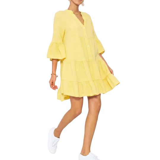 Yellow dress worn by a person on a white background