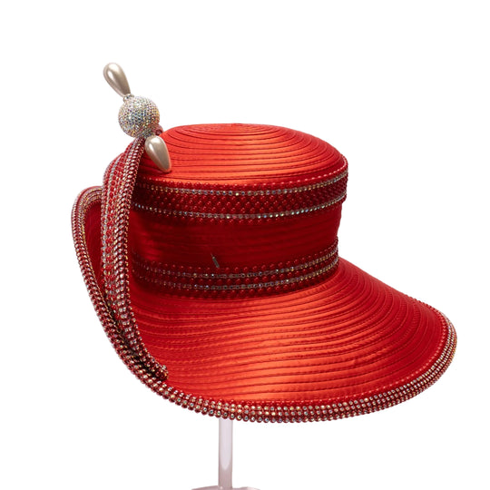 Red hat with decorative band and embellishments on a light pink background