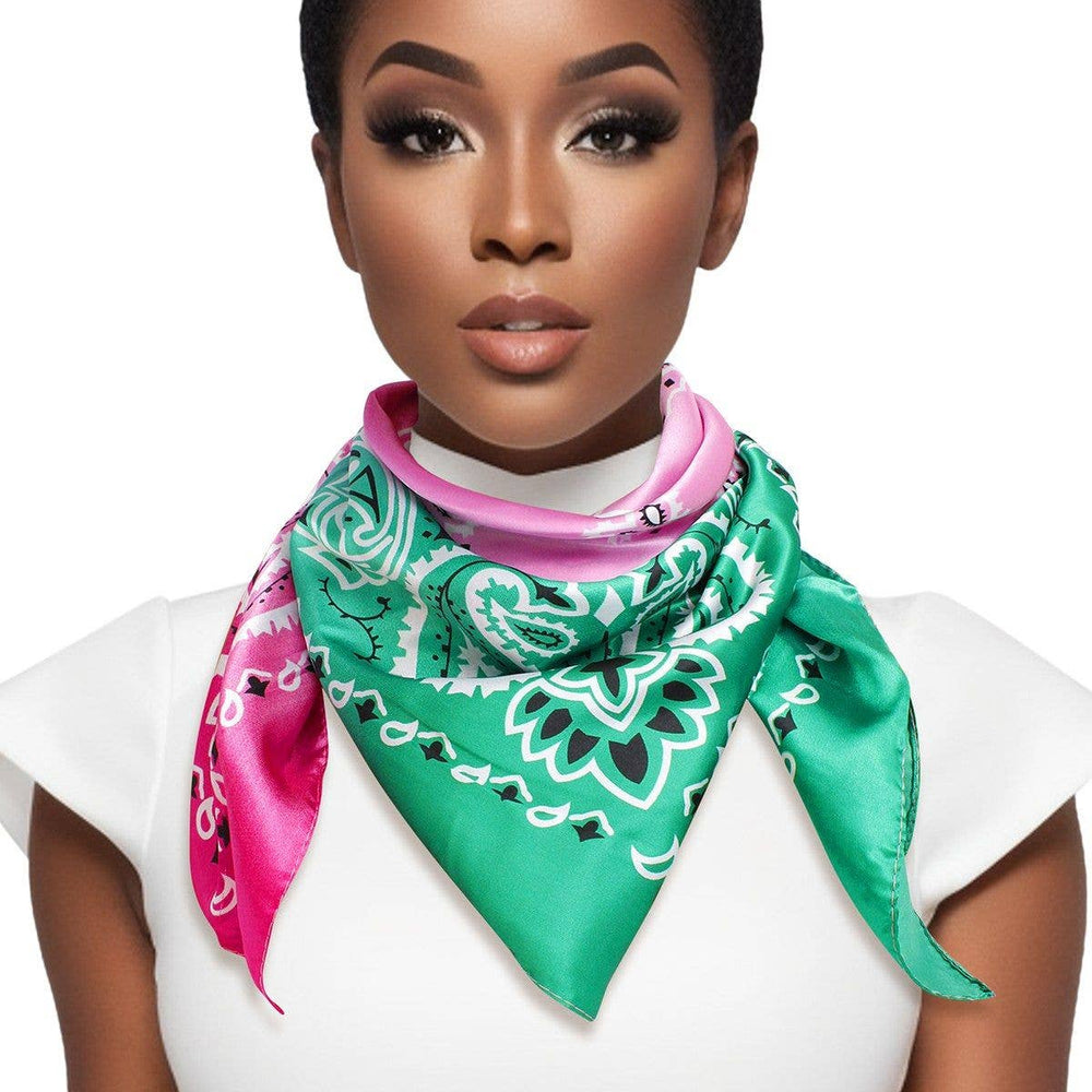 Woman wearing a green and pink patterned scarf on a white background