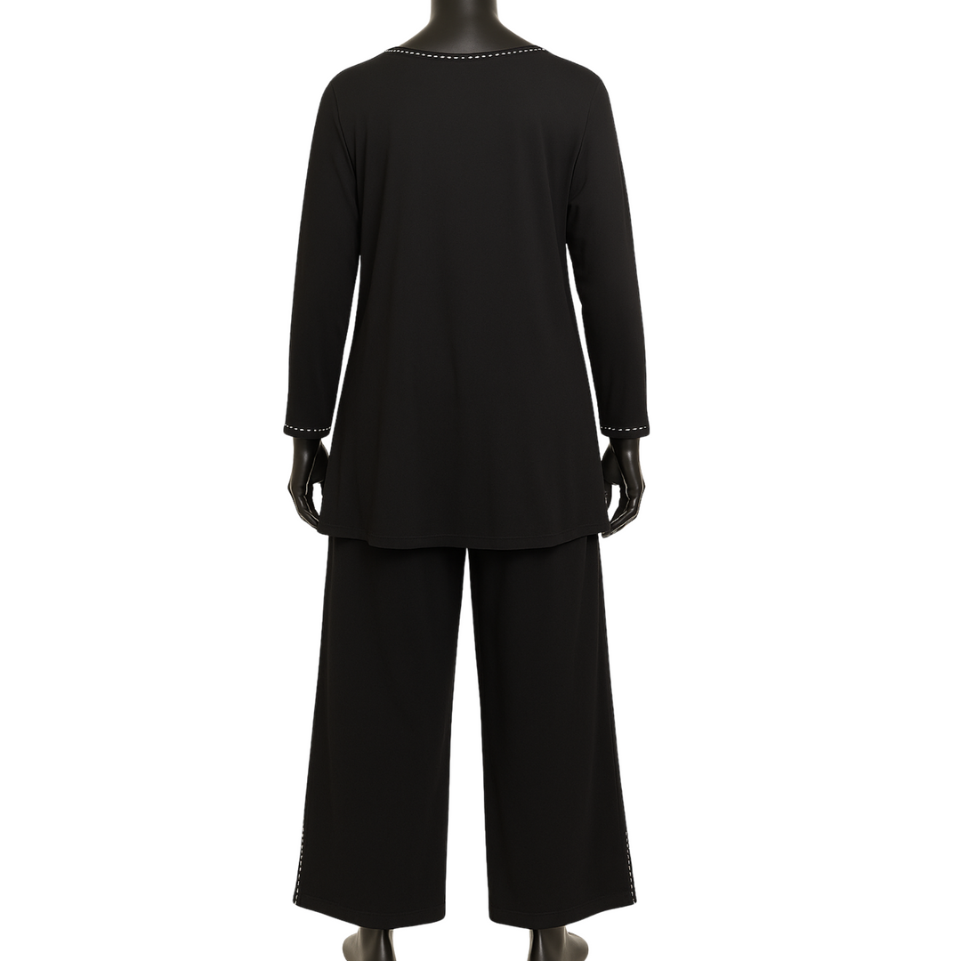 Black outfit on a mannequin with a plain white background