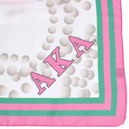Fabric with 'AKA' letters and pink and green border on a white background