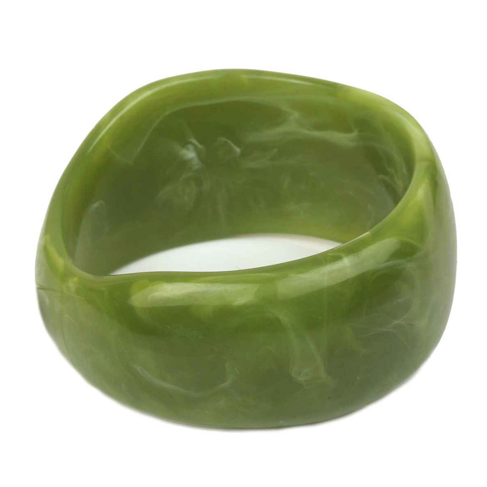 Green bangle on a white background