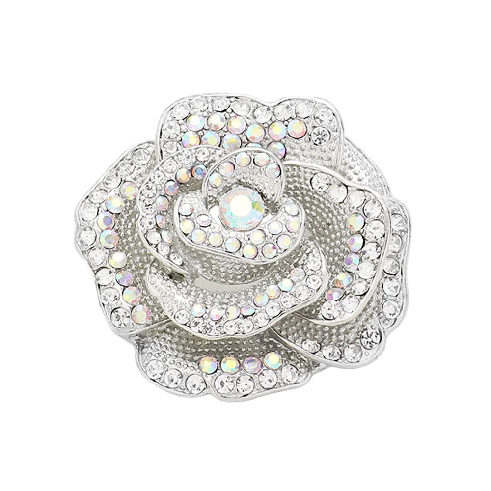 Decorative rose brooch with rhinestones on a white background