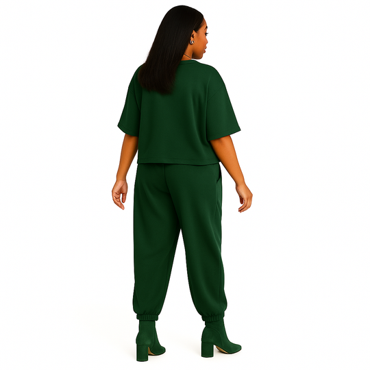 Person wearing a green outfit on a white background