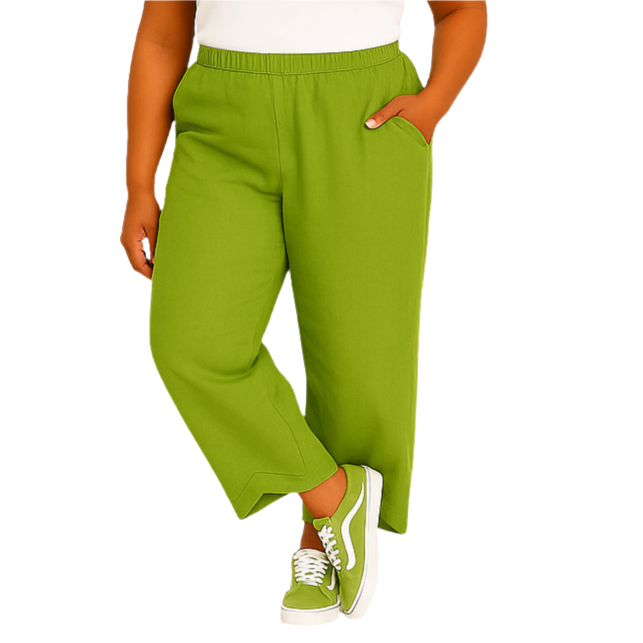 Person wearing green pants and white sneakers on a white background