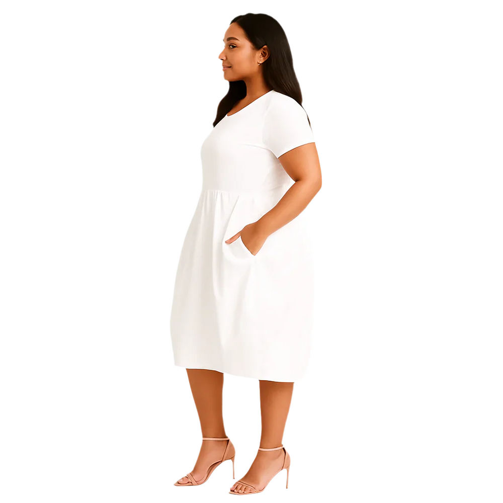 Woman wearing a white dress on a white background