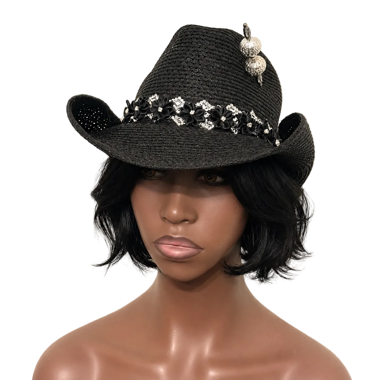 Black straw cowboy hat with decorative elements on a neutral background