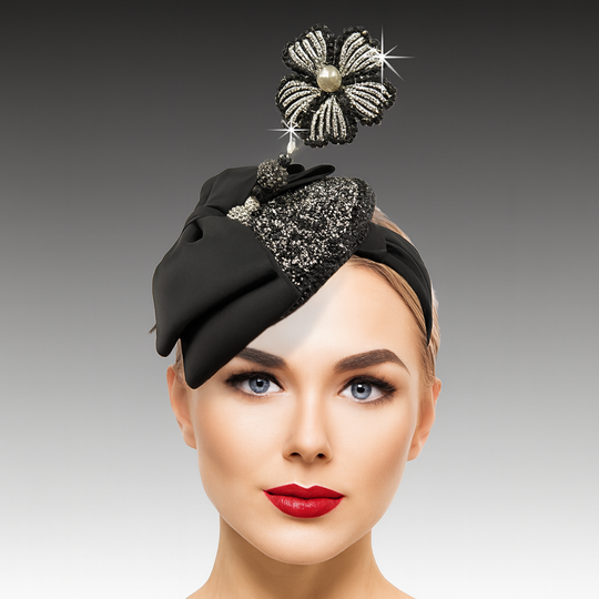 Woman wearing a black decorative headpiece with a gray background